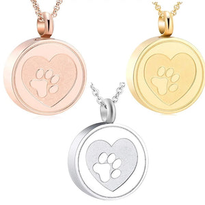 Trois pendentifs porte-cendres ronds pour chien, motif cœur et patte en relief, en or rose, doré et argenté