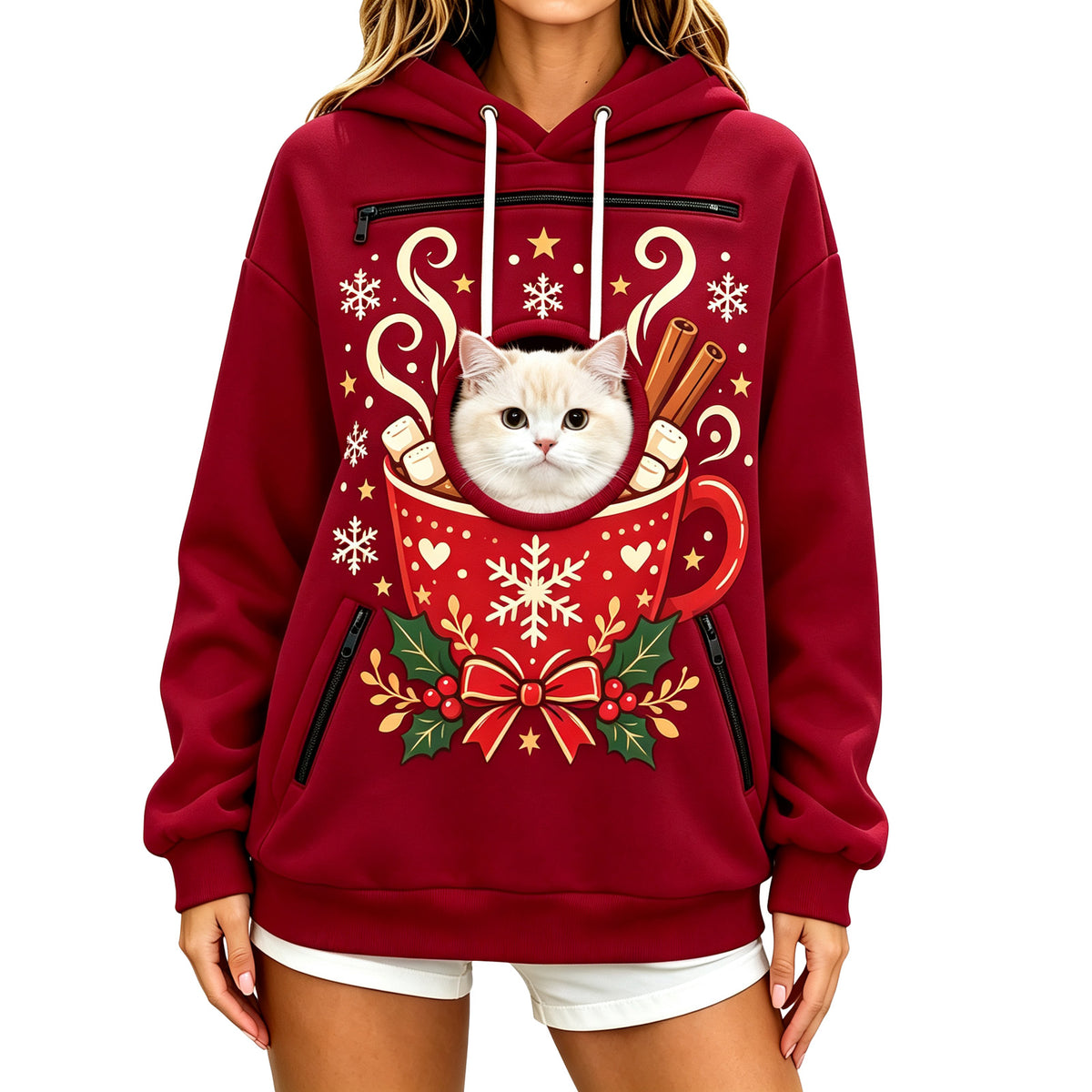 Pull de Noël bordeaux à capuche, un chat blanc passe la tête par l'ouverture ronde au centre d'une tasse de chocolat chaud imprimée