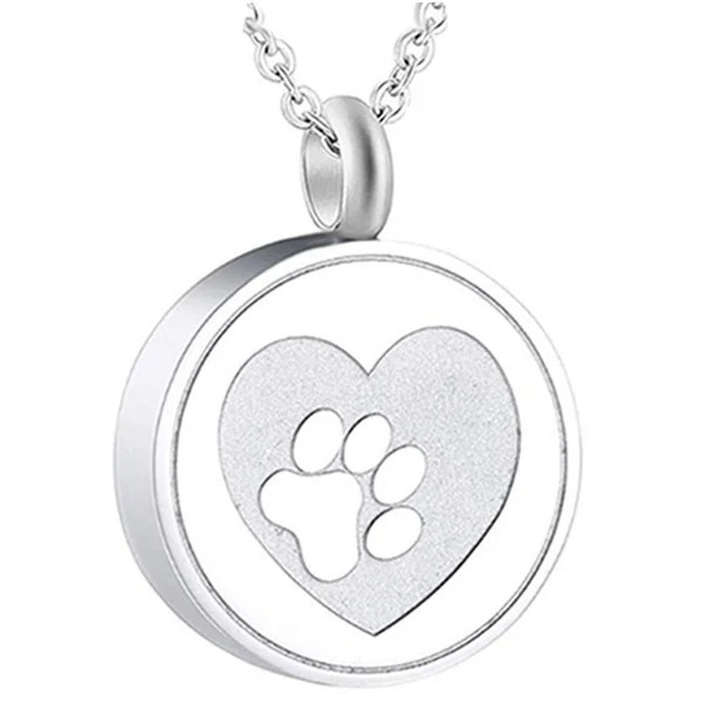 Pendentif porte-cendres chien argenté : cœur mat et empreinte de patte en relief